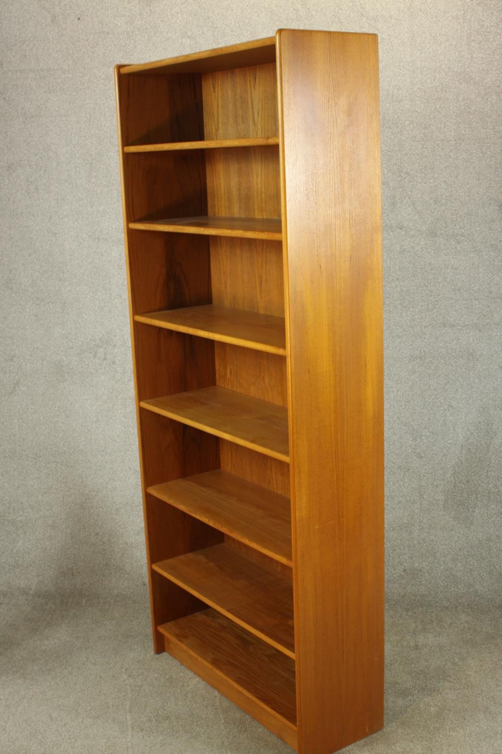 A late 20th century teak floor standing open bookcase raised on plinth base. H.178 W.77 D.29cm. - Image 3 of 4