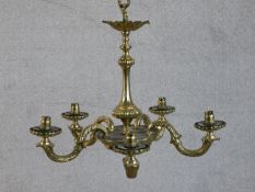 A 20th century brass chandelier, with five scrolling acanthus leaf decorated branches. H.43 W.54cm