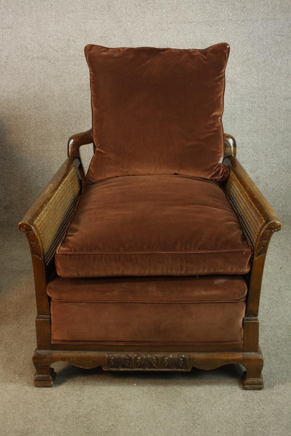 A pair of early 20th century carved mahogany framed and bergère armchairs, each with scroll arms and - Image 2 of 9