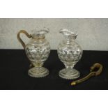 A matched pair late 19th / early 20th century brass handled dimple glass jugs raised stepped