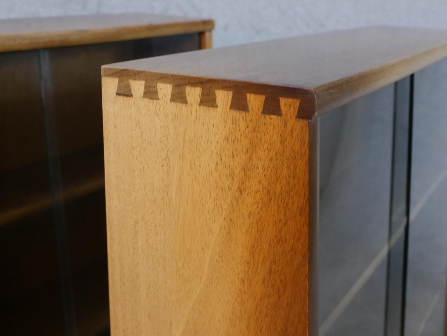 A pair of circa 1970s Jonell bookcases, with a pair of glass sliding doors enclosing shelves, on a - Image 7 of 8