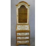 A 20th century painted Florentine style bureau bookcase, the domed top with single lattice effect