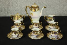 A 20th century Noritake six person coffee set comprising six cups and saucers, coffee pot, milk