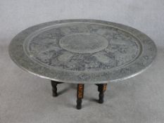 A mid 20th century heavy Sri Lankan pierced white metal, possibly pewter folding table raised on six