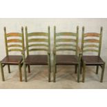 A set of four painted 19th / early 20th ladder back dining chairs, with turned finials raised on