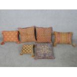 Six assorted Eastern fabric scatter cushions of varying designs. H.40 W.40cm (largest)