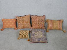 Six assorted Eastern fabric scatter cushions of varying designs. H.40 W.40cm (largest)