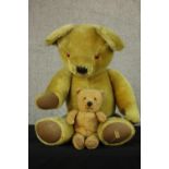An early 20th century Merrythought brown articulated limb teddy bear together with a Chiltern