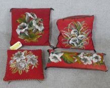 A group of four Victorian beadwork squab cushions, with still lives of flowers on red ground. H.40