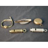 Assorted collectors items to include Metropolitan whistles, a horn handled folding spoon, a 1970s
