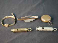 Assorted collectors items to include Metropolitan whistles, a horn handled folding spoon, a 1970s