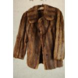 A ladies vintage half length brown mink silk lined jacket from Harvey Nichols, label to inside of