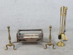 A 19th century iron fire basket complete with a pair of brass andirons, together with an