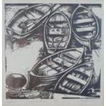 A framed and glazed linocut of wooden rowing boats in the harbour, indistinctly signed, numbered