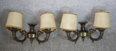 A pair of 20th century Renaissance Revival wall sconces, each with twin cornucopia form branches and