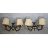 A pair of 20th century Renaissance Revival wall sconces, each with twin cornucopia form branches and