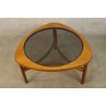 Nathan Furniture, a circa 1960's teak coffee table, with a circular smoked glass top on three