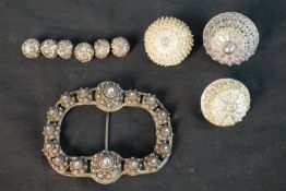 A collection of nine Danish white metal filigree traditional folk costume buttons, a set of six