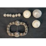 A collection of nine Danish white metal filigree traditional folk costume buttons, a set of six