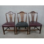 A set of three 18th century mahogany dining chairs, with pierced splat backs and leather upholstered