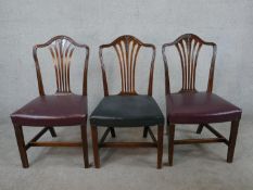 A set of three 18th century mahogany dining chairs, with pierced splat backs and leather upholstered