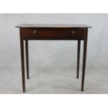 An 18th century mahogany side table, with a bow fronted top over a long drawer on square section