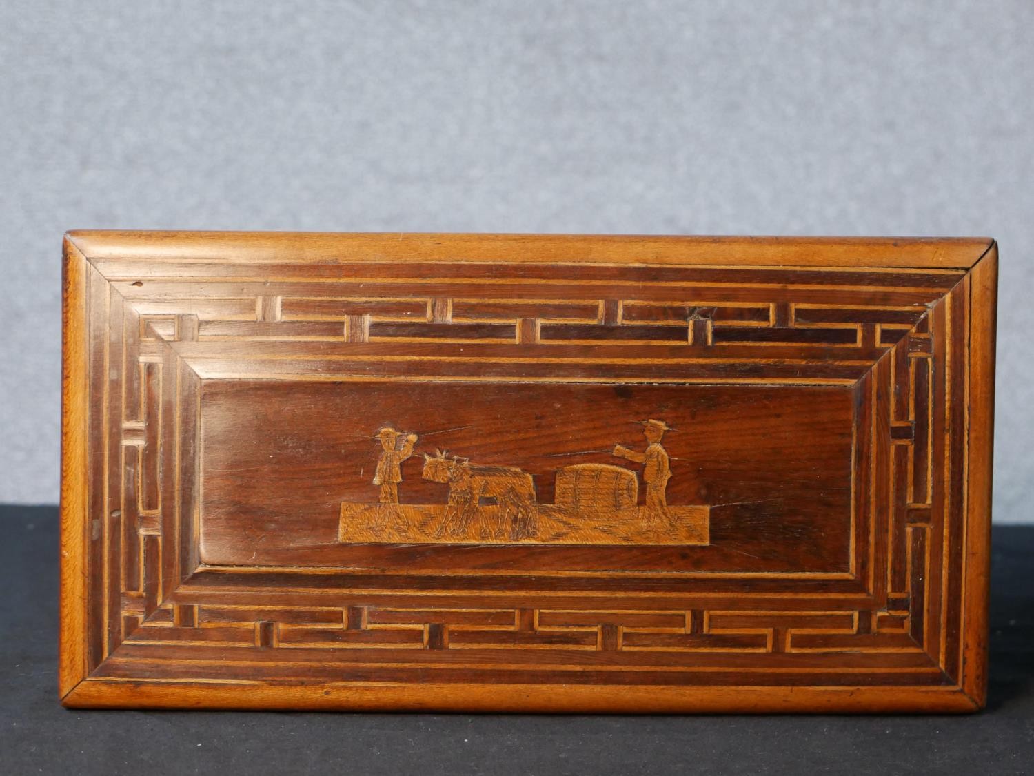 A carved Chinese hardwood lidded box; the lid carved with a farmer and oxen driven plough within - Image 3 of 9