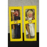 Four boxed vintage Pelham Puppets, Policeman, Fairy, Donald Duck and Wicked Witch. H.36 W.13 D.