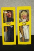 Four boxed vintage Pelham Puppets, Policeman, Fairy, Donald Duck and Wicked Witch. H.36 W.13 D.