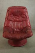 A late 20th century Scandinavian Stressles style red leather chair with footstool. H.105 W.80 D.