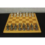A contemporary brass chess set complete with board. H.10 W.50 D.50cm.