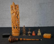 A collection of figures and boxes, including a bronze Indian deity, brass Buddha, carved hardwood