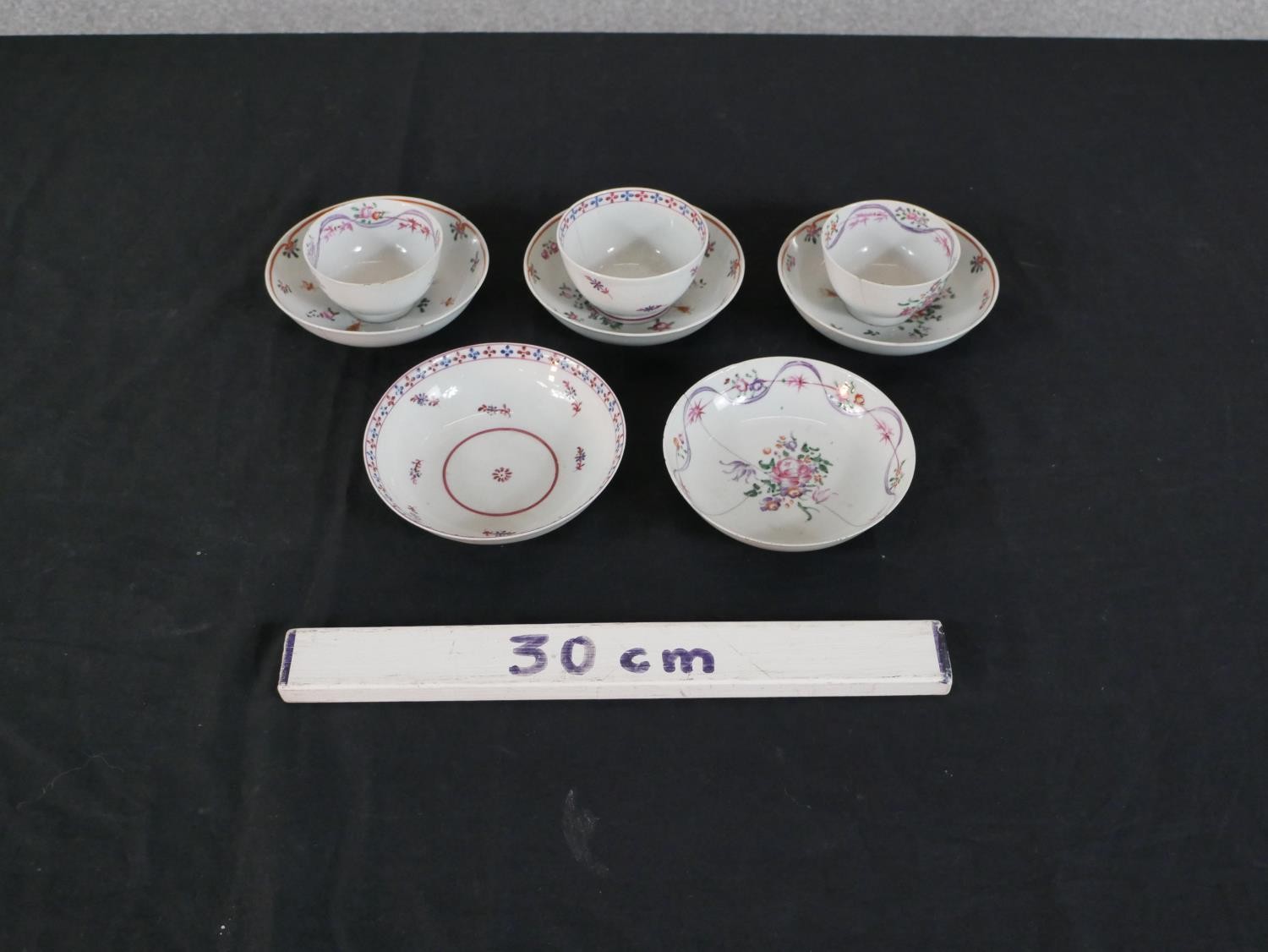 A collection of 19th century Chinese hand painted Famille Rose floral design tea bowls and saucers - Image 2 of 13
