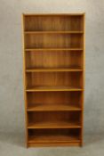 A late 20th century teak floor standing open bookcase raised on plinth base. H.178 W.77 D.29cm.