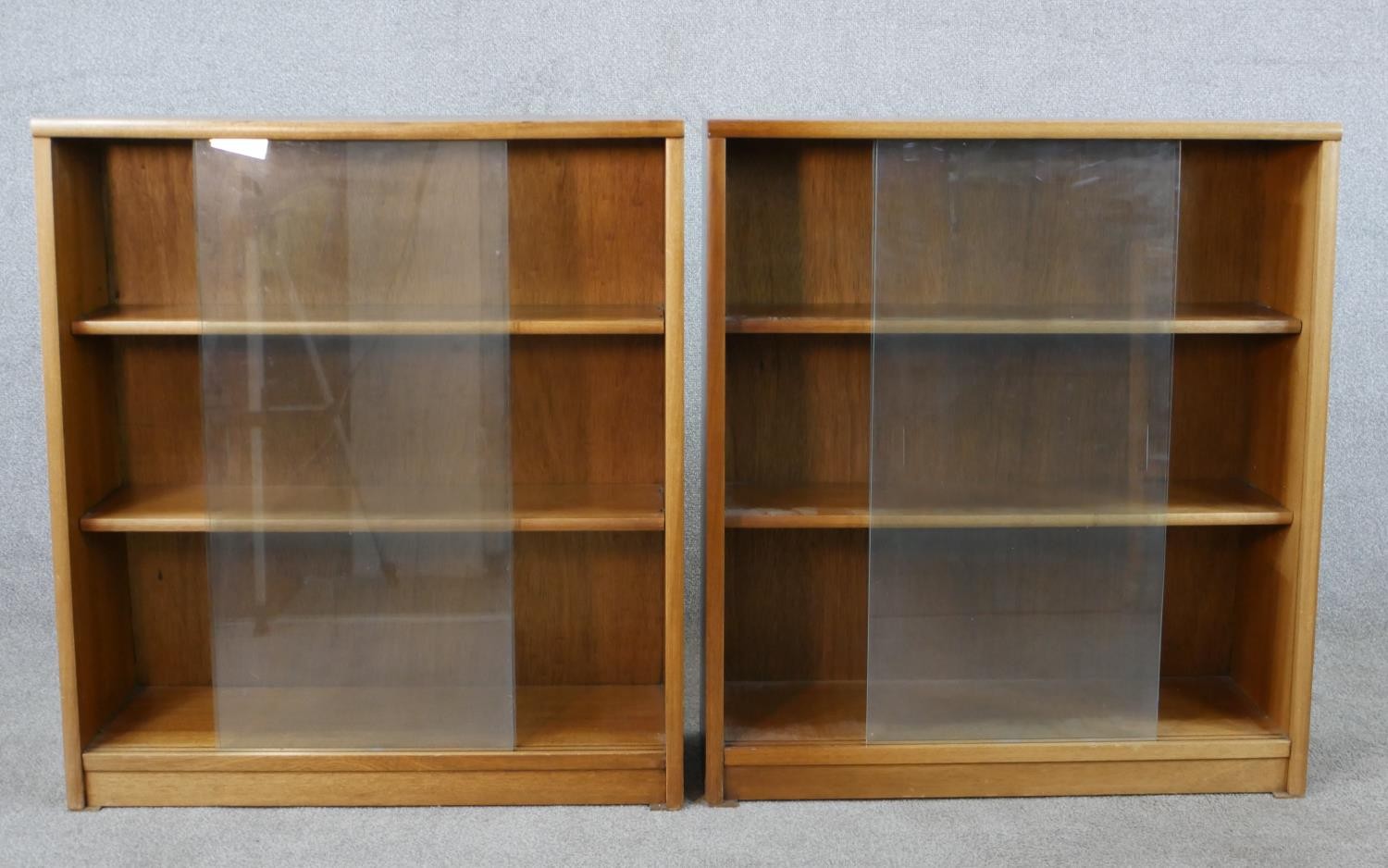 A pair of circa 1970s Jonell bookcases, with a pair of glass sliding doors enclosing shelves, on a - Image 4 of 8