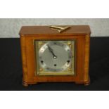 An Art Deco Elliot of London walnut cased mantle clock, the silvered dial with black etched Roman