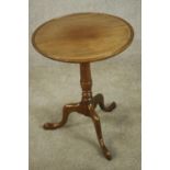 A George III mahogany wine table with turned central column on three outswept supports on pad
