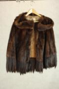 A lady's vintage half-length mink fur coat with fur fringing, labeled Marshall & Snelgrove, London.