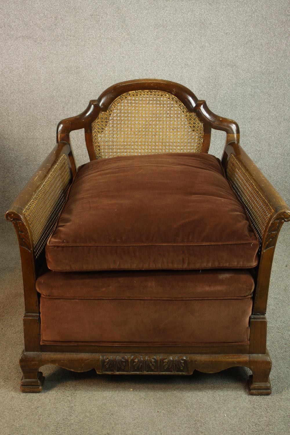 A pair of early 20th century carved mahogany framed and bergère armchairs, each with scroll arms and - Image 4 of 9