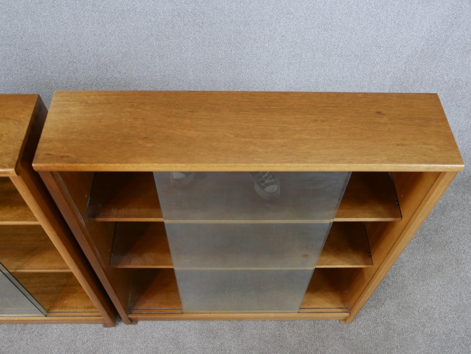 A pair of circa 1970s Jonell bookcases, with a pair of glass sliding doors enclosing shelves, on a - Image 5 of 8
