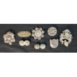 A collection of nine silver and white metal Danish traditional folk costume brooches, one with a