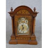 A late 19th / early 20th century inlaid oak cased dome topped Westminster chime mantle clock