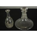 A 19th century clear glass triple ring ships decanter and stopper together with a faceted glass