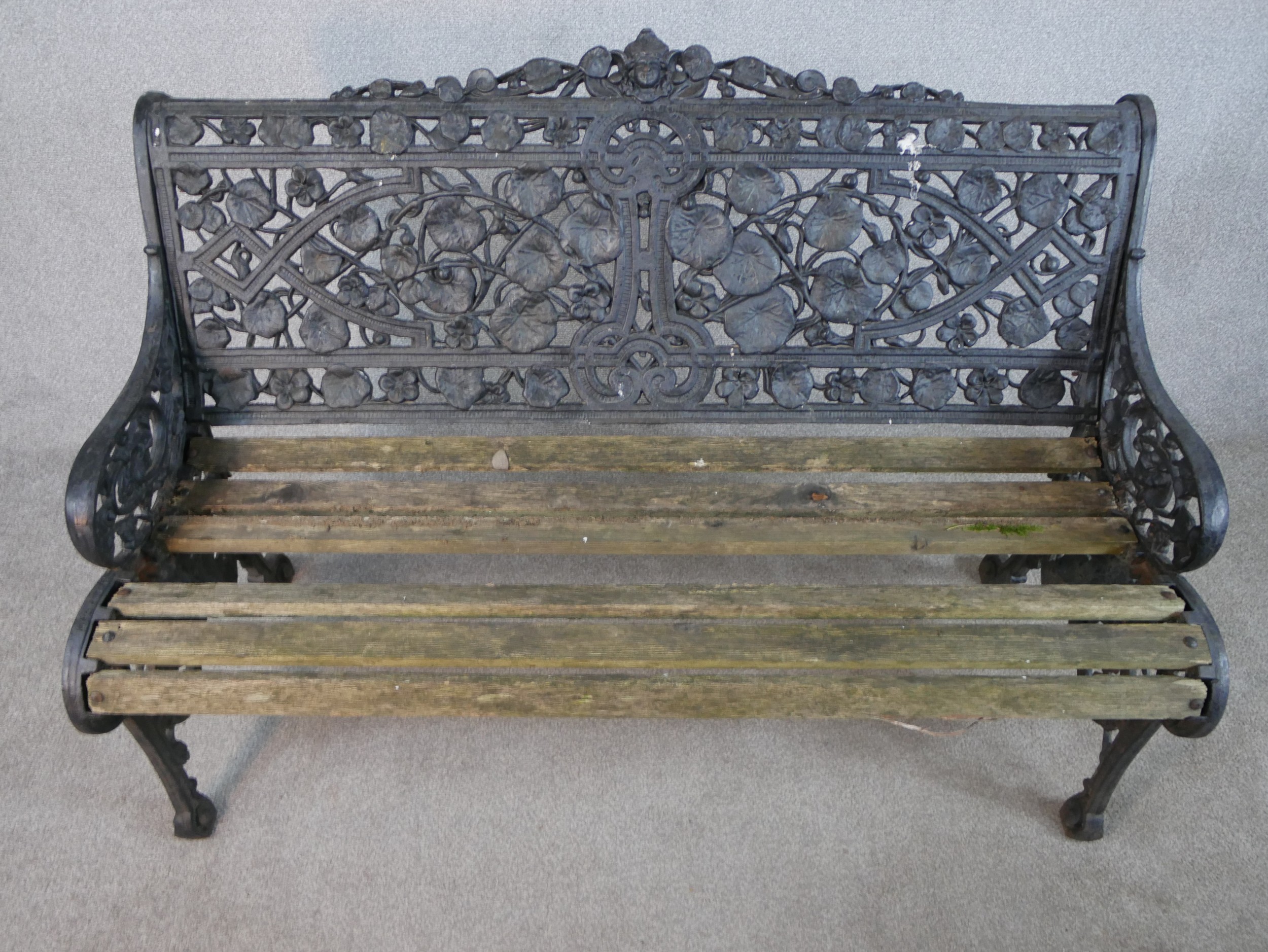 A Victorian Coalbrookdale style cast iron garden bench, in nasturtium pattern, missing one seat - Image 2 of 9