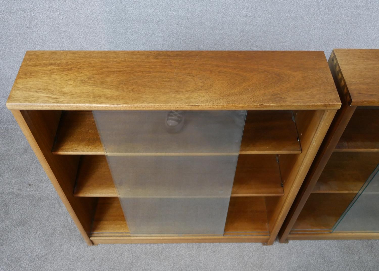 A pair of circa 1970s Jonell bookcases, with a pair of glass sliding doors enclosing shelves, on a - Image 3 of 8