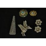A collection of paste set brooches and a scarf clip, including a pair of rose design paste set