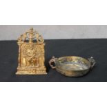 A 19th century gilt brass pocket easel shrine of a seated gentlemen together with a gilt brass