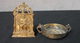 A 19th century gilt brass pocket easel shrine of a seated gentlemen together with a gilt brass