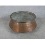 A 19th / early 20th century copper, probably Indian copper cooking pot. H.30 W.60 D.60cm