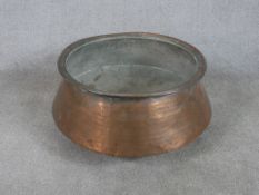 A 19th / early 20th century copper, probably Indian copper cooking pot. H.30 W.60 D.60cm
